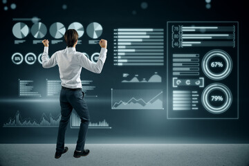 businessman celebrating success on abstract glowing background with blue business charts and graphs hologram. Finance, ai, digital transformation and fintech concept.