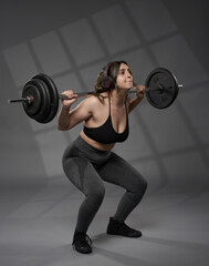 Fototapeta na wymiar Size plus indian woman doing fitness workout