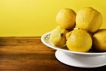 Fresh lemons in plate