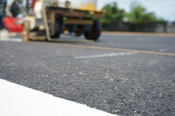Blurred image, road marking work to provide safety on highways