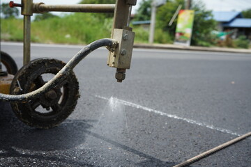 spraying solution before hitting the traffic line