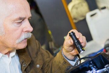 senior checking something