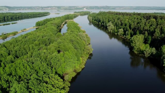Picturesque views from the air and drone nature of Tatarstan and Russia. Sviyaga River. The river sprouts vegetation. Quiet ples stretch. Panorama for travel and tourism. Berry fields. From above. 
