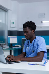 Hospital specialized nurse analyzing patient medical tests results and writing prescription based on illness and health condition of patient. Healthcare staff reviewing consultation files and