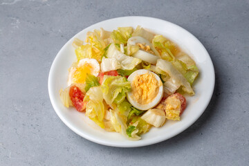 Egg diet salad with lettuce and tomato
