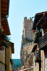 Obraz premium Street in Frias with the castle in the background, Burgos, Spain