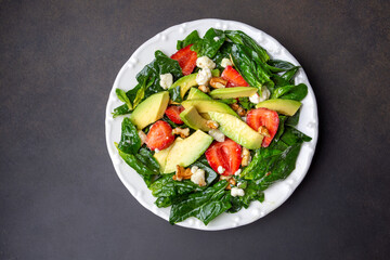 Healthy diet salad; Strawberry Spinach Salad with Avocado.