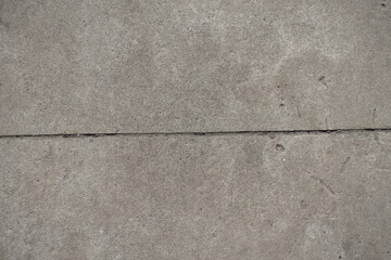 Fototapeta premium Horizontal joint between two simple gray concrete slabs