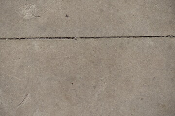 Obraz premium One horizontal joint between two simple gray concrete slabs