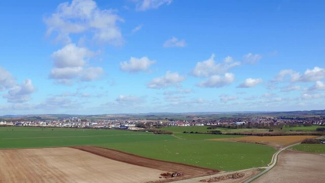 Revealing Aerial Shot of Dorset Farming with Tractors