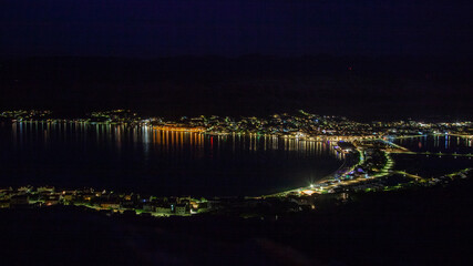 Night panorama of the city by the water - 509753224