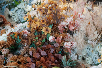 Multi-colored dried flowers and leaves (artificial) for decoration.