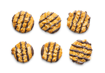 Chip cookies with peanuts and chocolate strips isolated on white background.