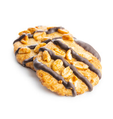 Chip cookies with peanuts and chocolate strips isolated on white background.
