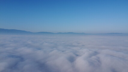 Above the fog in the morning. Above the clouds.