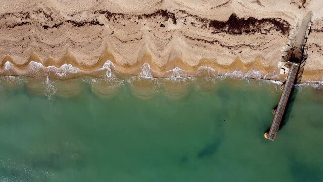 Aerial View of Sea and Pier on Beach in Dorset