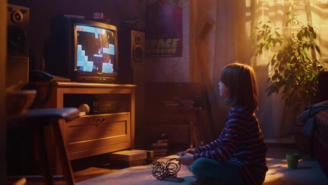 Nostalgic Retro Concept: Young Girl Playing Old-School Nineties Arcade Video Game on a Console at Home in Her Room with Period-Correct Interior. Successful Kid Passes the Level with Flying Colors.