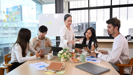 Team of professionals brainstorming and discussing ideas of the new startup project together