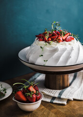 summer dessert of Pavlova with strawberries and whipped cream