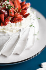 summer dessert of Pavlova with strawberries and whipped cream