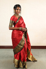 Indian woman wearing red orange traditional royal saree jewellery choker set necklace jhumka...
