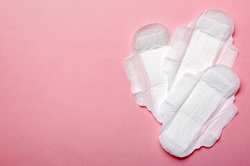 Women hygiene products or sanitary pad on colored background. Pastel color. Closeup. Empty place for text. Female daily hygiene