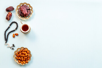 Ramadan Kareem background. Islamic rosary and dates fruits with tea