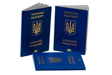 Three passports of Ukrainian citizens or migrants for visa-free travel to the European Union isolated on white background. Clipping path. Refugees in European countries.