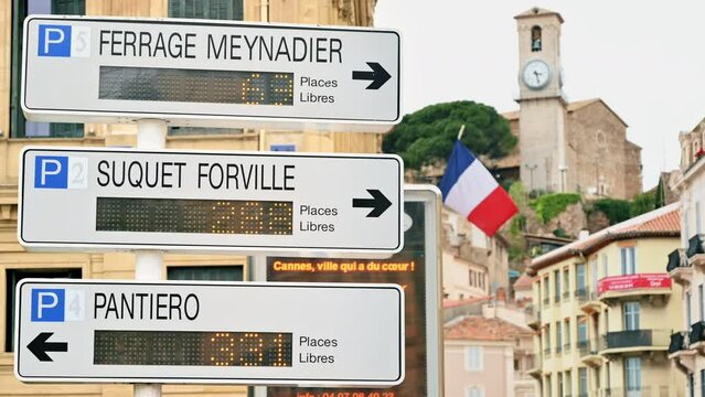 Pillar with arrows showing the direction of movement of buses in Cannes, France