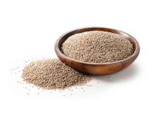 White chia seeds in a wooden dish placed on a white background.