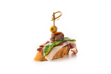 Anchovy, pepper, serrano ham and olive pintxo isolated on white background