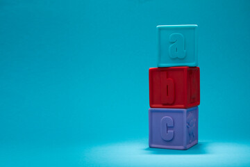 Kids alphabet block. Alphabet Block Spelling ABC isolated on blue background