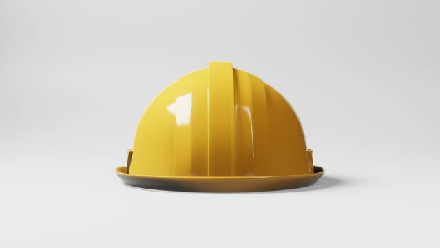 Seamless looping yellow hardhat construction helmet motion rotating 360 degrees angle on white background. Business and industrial safety concept. 4K footage video motion graphic