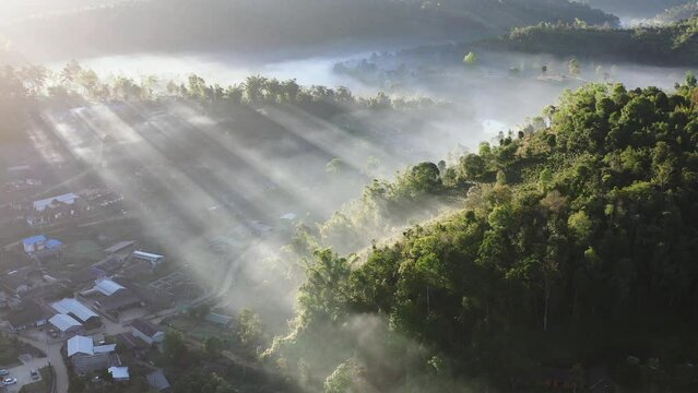 Sunrise with fog over Ban Rak thai, chinese village near a lake in Mae Hong Son, Thailand