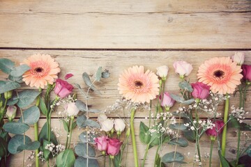 Beautiful bouquet with gerberas and lisianthus on old wooden background - greeting card - mother's...