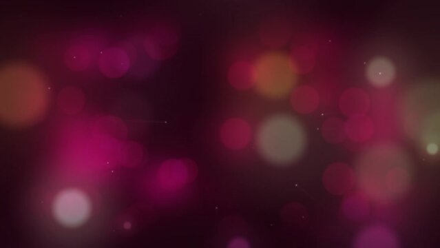 Animation of colorful bokeh moving on dark background