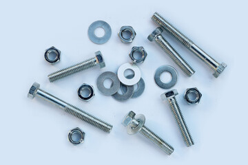 Screws and nuts on white background.