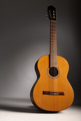 Fototapeta premium Classical guitar on grey background with copy space