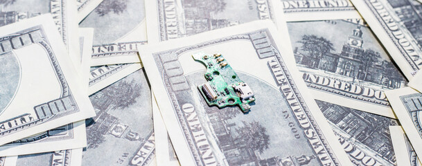 Circuit board on banknotes. Increasing the cost of electronics
