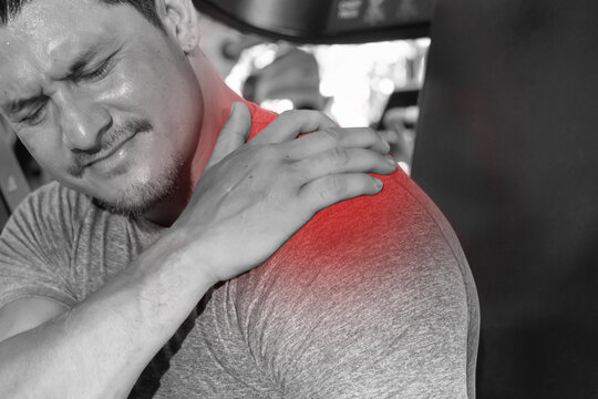 Man Grab His Shoulder with Pain by Shoulder Injured Symtom