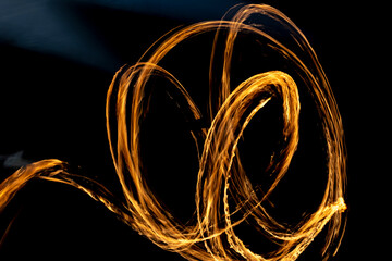 Line of fire in dark. Flame texture.