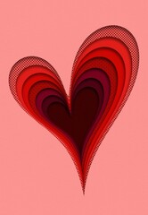 Layered red paper cut heart on a pink background. Heart in all shades of red color on light pink background. 