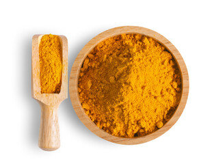 Turmeric powder pile in wood bowl and scoop isolated on white