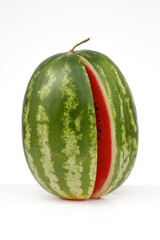 Watermelon on a white table and white background, fresh fruit.