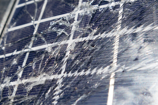 Close up of broken solar panel after a hail storm