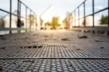 Part of metal anti-slip floor and protection handrail of the walking way at the refinery plant with...