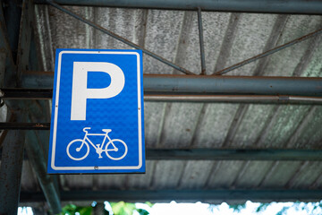 Bicycle parking lot reservation sign which is installed on the parking ceiling structure....