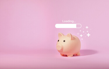 Piggy bank isolated on pink background. Saving money concept.