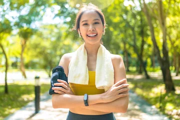 Keuken spatwand met foto sport asian female teen portrait shot while morning running jogging healthy routine activity sunnday at public park,asia woman wear sport wear smile look at camera while take a break from run exercise © whyframeshot