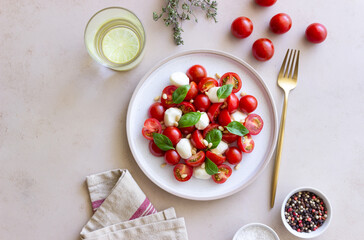 Salad with mozzarella, tomatoes, nuts and basil. Healthy eating. Vegetarian food. Diet.
